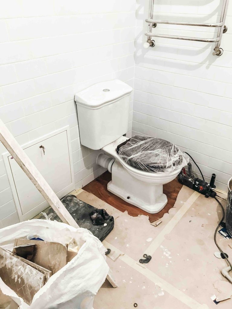 A photo of a bathroom remodel that needs a dumpster rental for clean up.